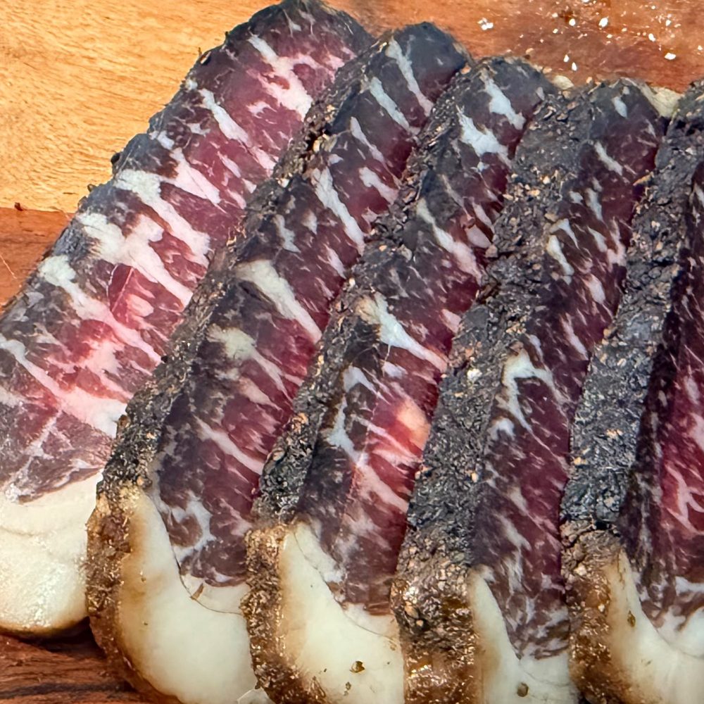 Close-up of marbled Wagyu biltong slices from a 1kg Connoisseur Carton